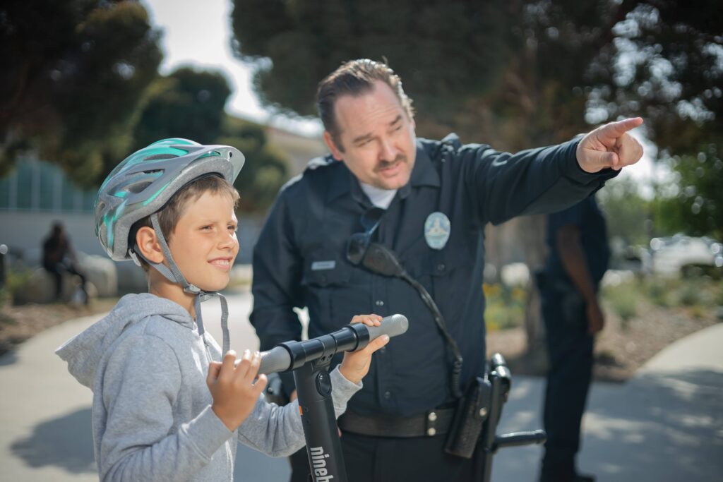School security guard interacting with students in the playground